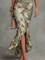 Anna - Asymmetrical long dress in green satin with V-neck, flared puff sleeves, and floral pattern | The Bellemont Sisters Au